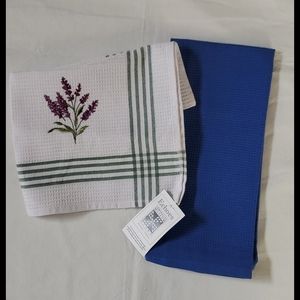 Multiple dish towels blue and white with floral design and red with stripes